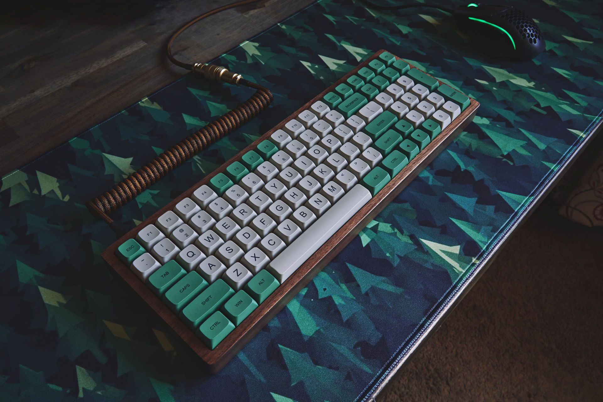 Forest desk mat on a wood desk with a wooden keyboard. Does this count as adding greenery to the office?